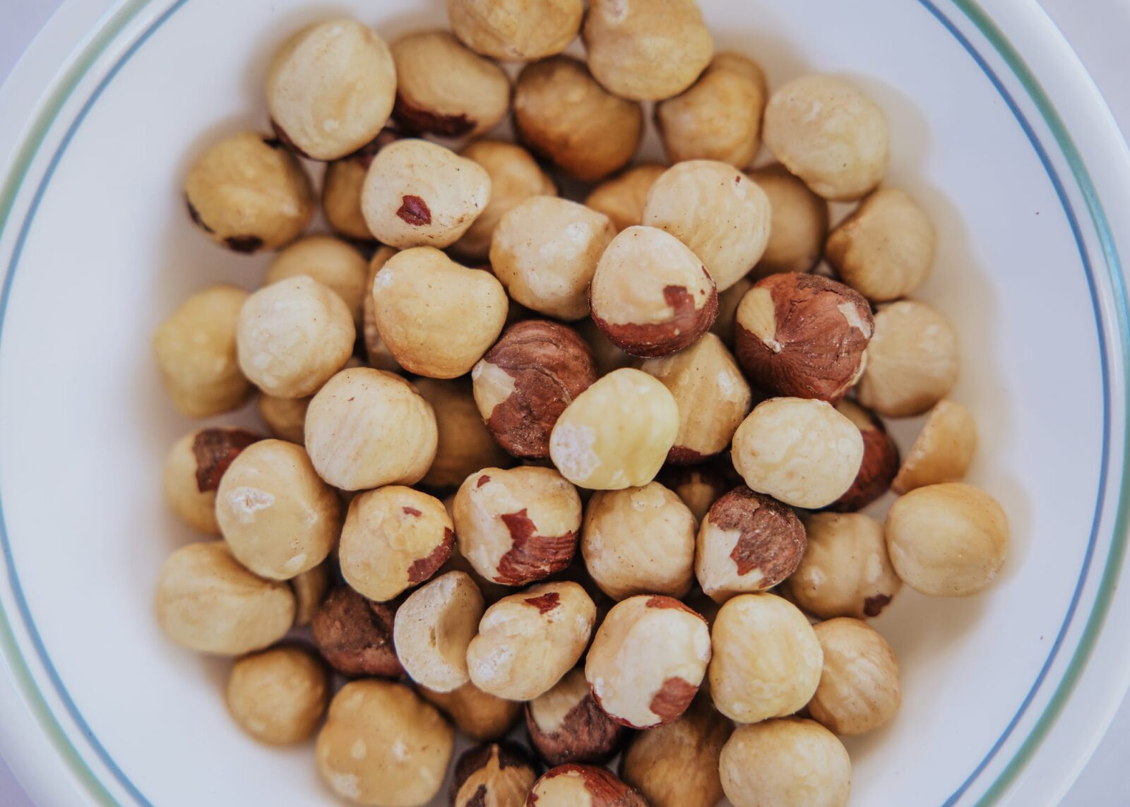 Shelled hazelnuts in a bowl, representing Australian hazelnut production and the hazelnut industry.