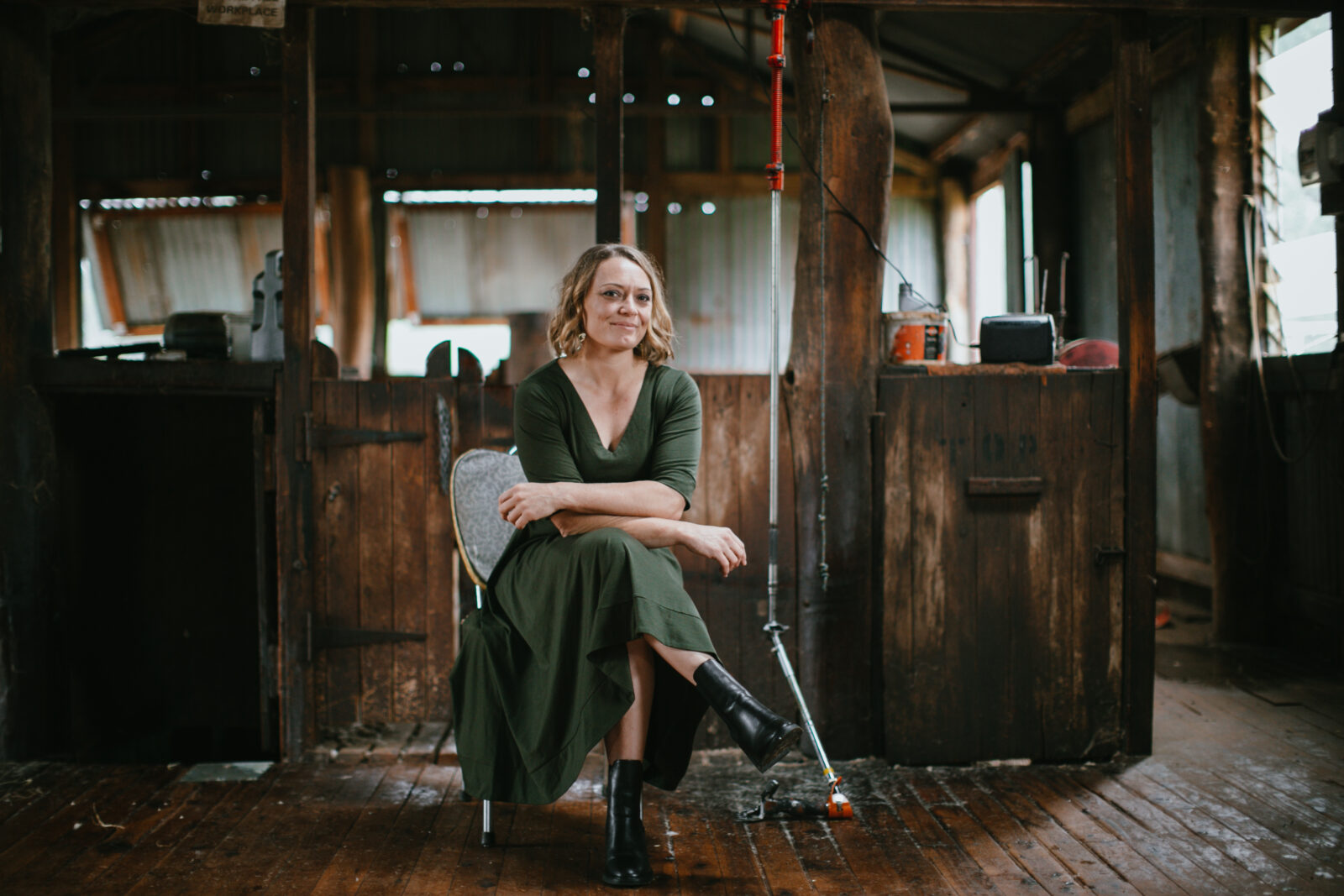 Carol Mudford, 2026 AgriFutures Rural Women’s Award National Winner, seated in a rustic wooden rural setting, representing leadership and innovation in Australian agriculture.